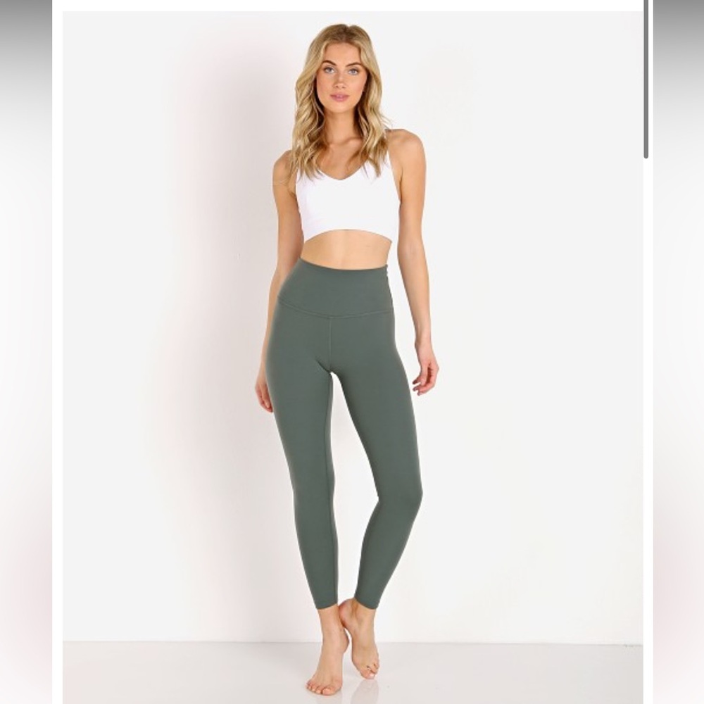 Beyond yoga Caught in the midi high waisted legging $88 small Dark tropic